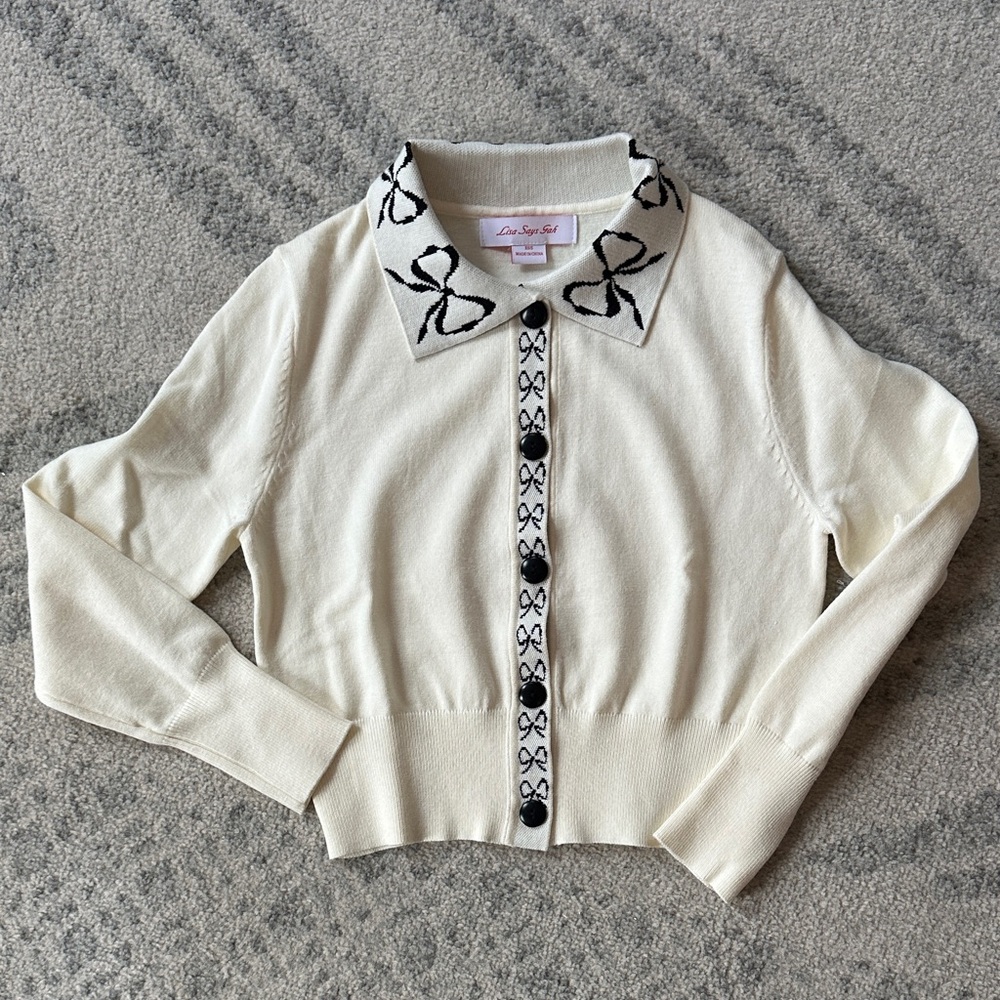 Lisa Says Gah Cream Sweater with Black Bow Accents